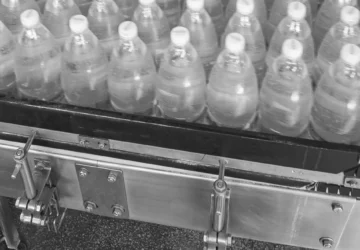 This is a photo of bottles on an assembly line