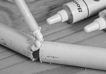 Glue being used on pipes
