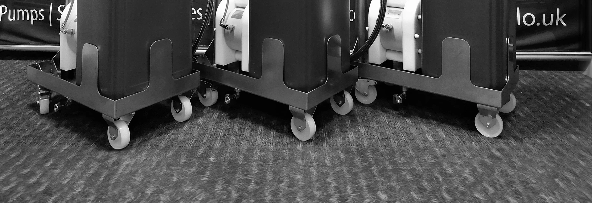 An image of 3 trollies with pumps mounted to them