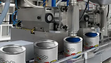 A photo of paint being pumped on a production line