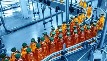 A photo of beverage bottles on a conveyor belt