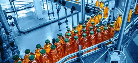 A photo of beverage bottles on a conveyor belt