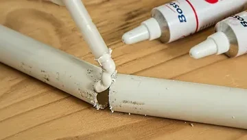 a photo of glue being used to fix something